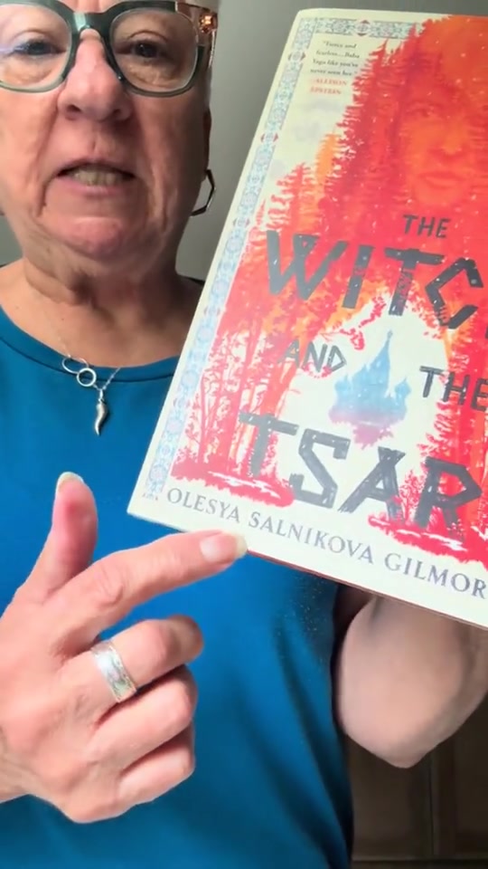 A reader showing books from her box